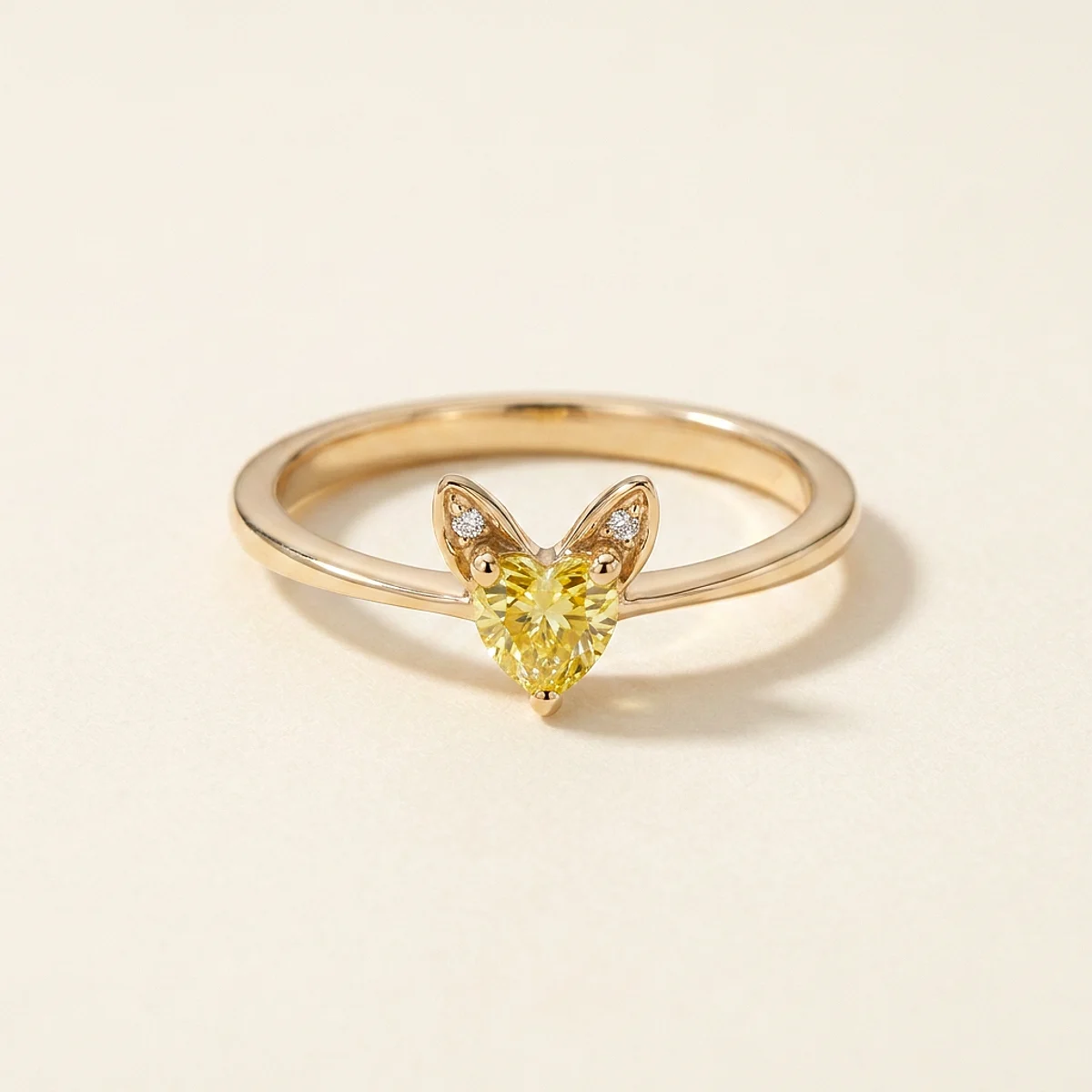 A .4ct yellow heart diamond on a yellow gold ring, custom-designed by Eterneva to honor the remarkable Vixxie.