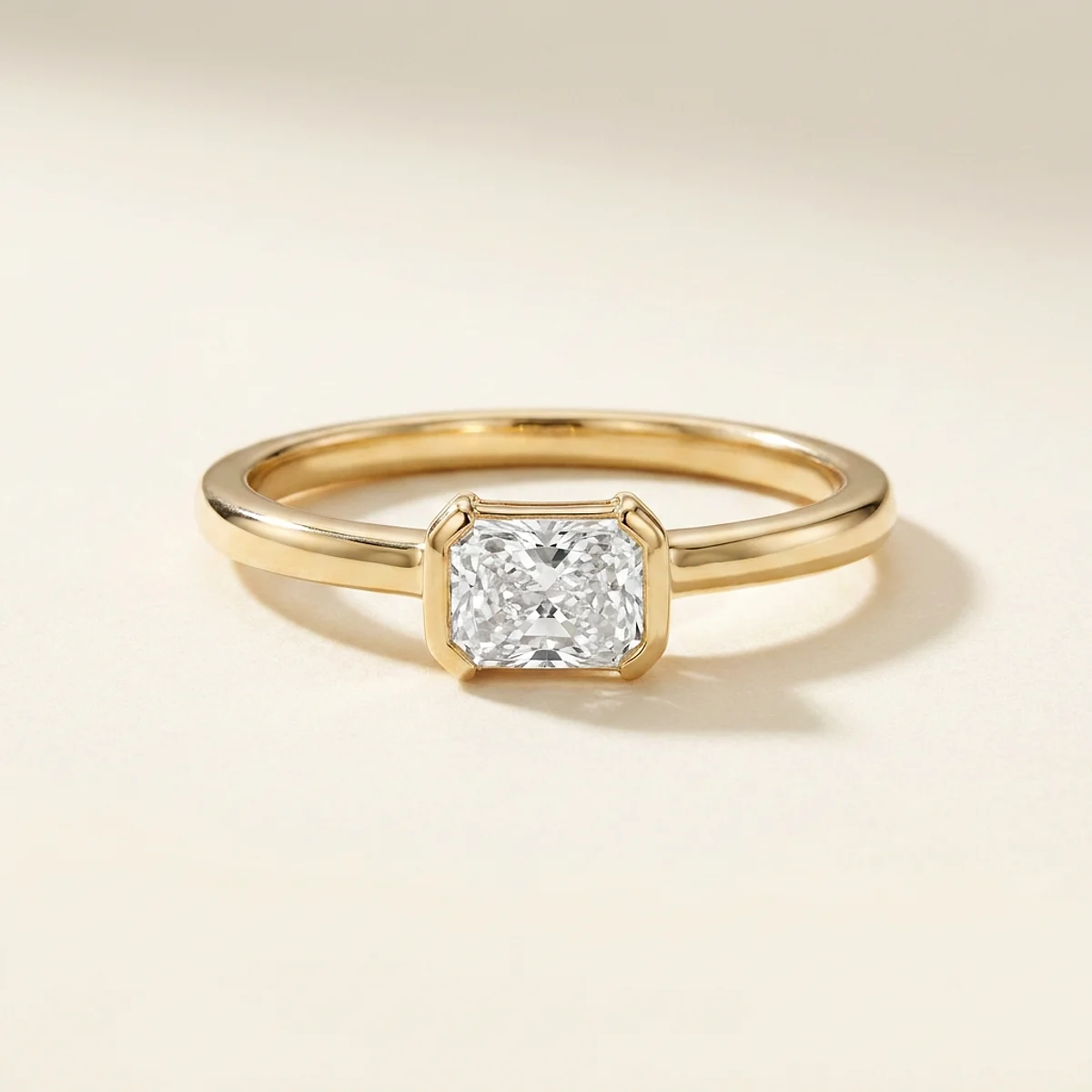 A .5ct colorless rectangular radiant diamond on a yellow gold ring, custom-designed by Eterneva to honor the remarkable Betty.