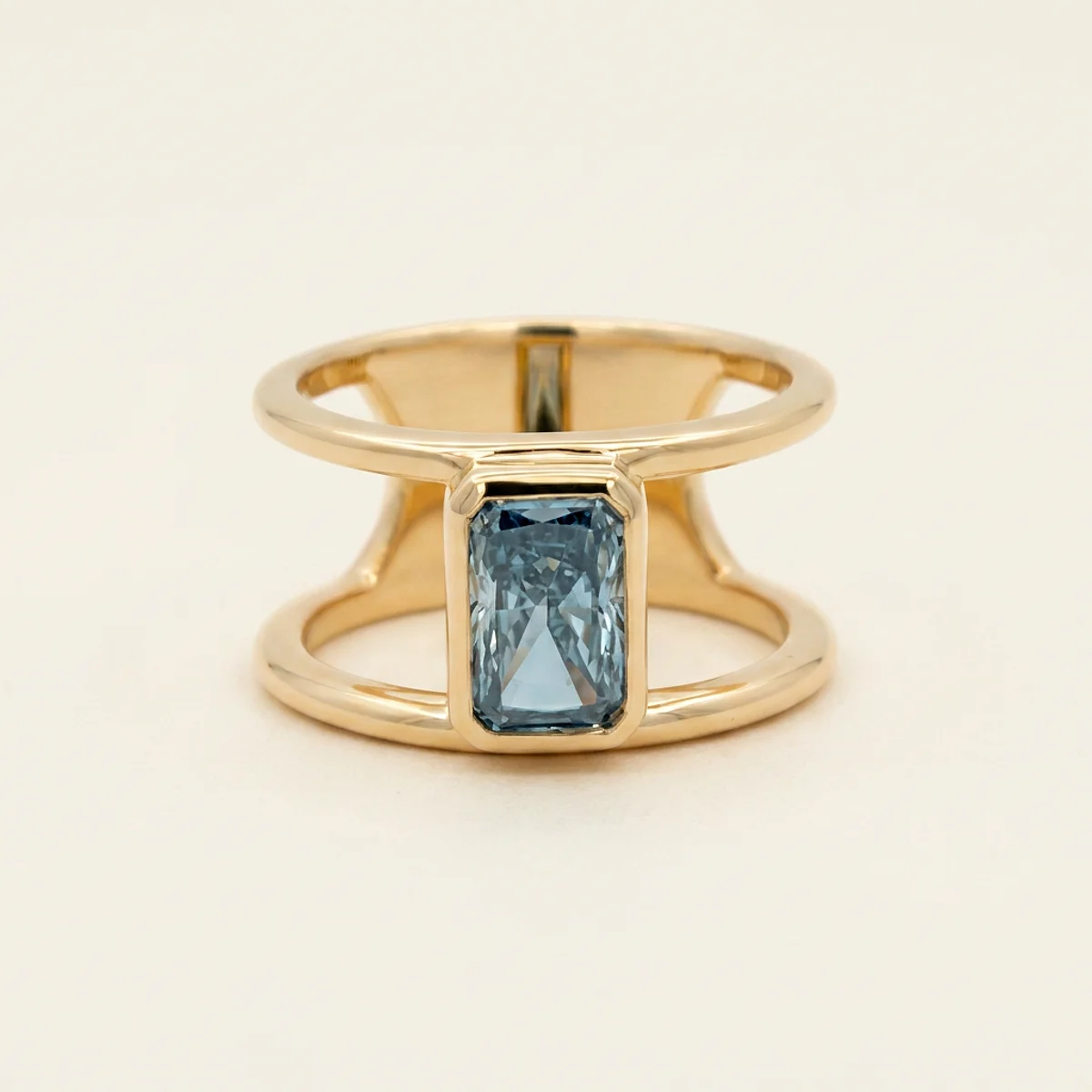A 1ct blue rectangular radiant diamond on a yellow gold ring, custom-designed by Eterneva to honor the remarkable Carlos.