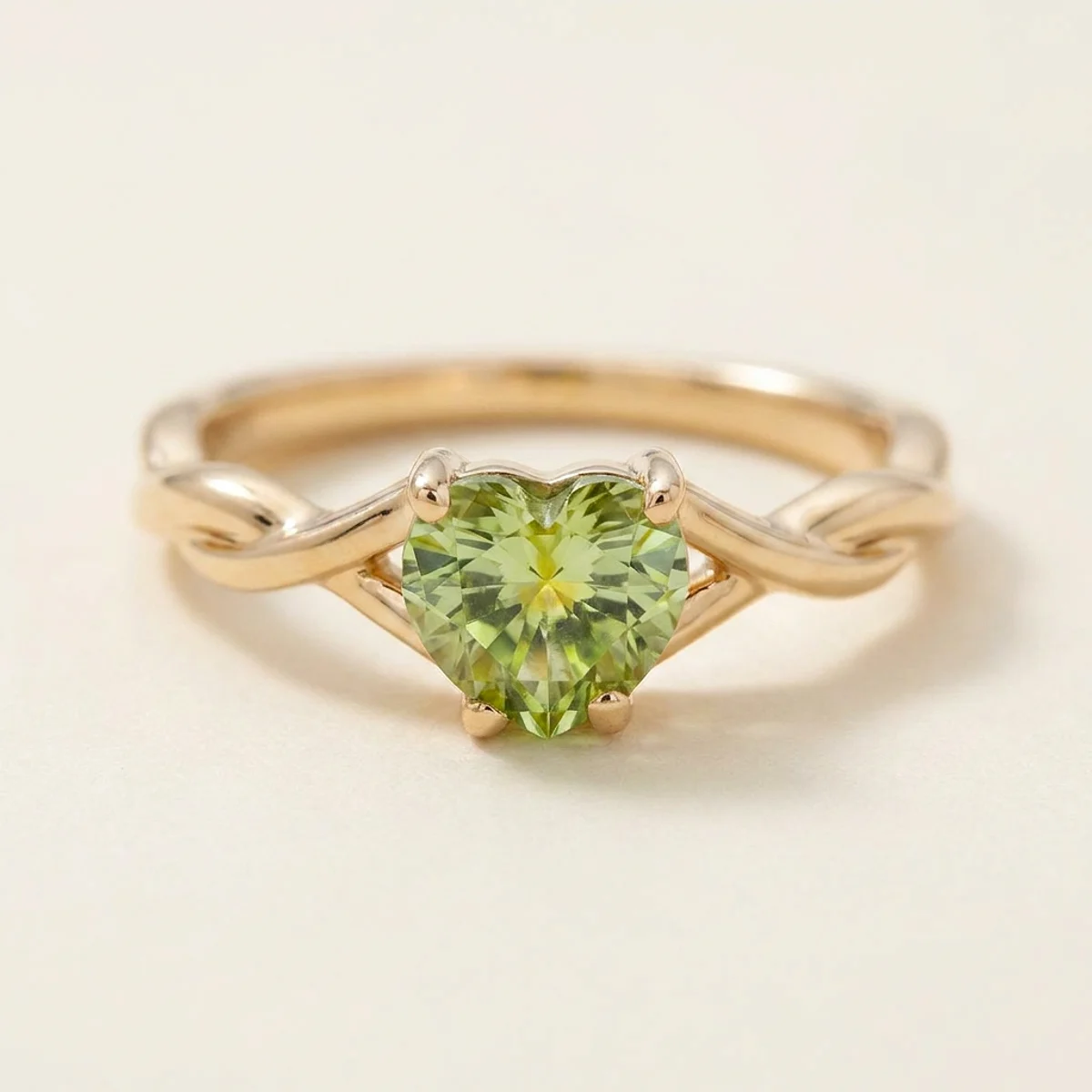 A .75ct green heart diamond on a yellow gold ring, custom-designed by Eterneva to honor the remarkable Adrien.