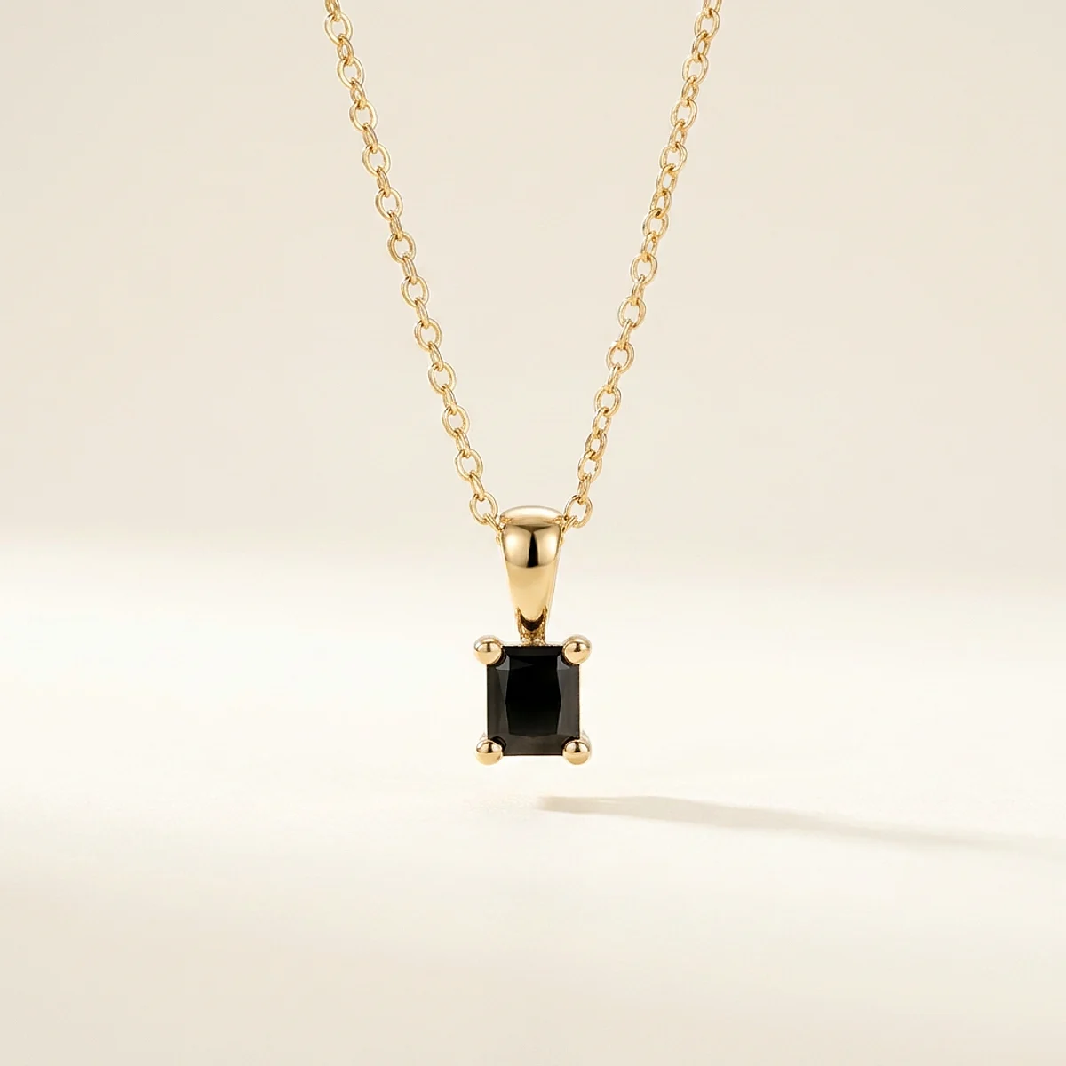 A .25ct black rectangular radiant diamond on a yellow gold pendant, custom-designed by Eterneva to honor the remarkable Bentley.