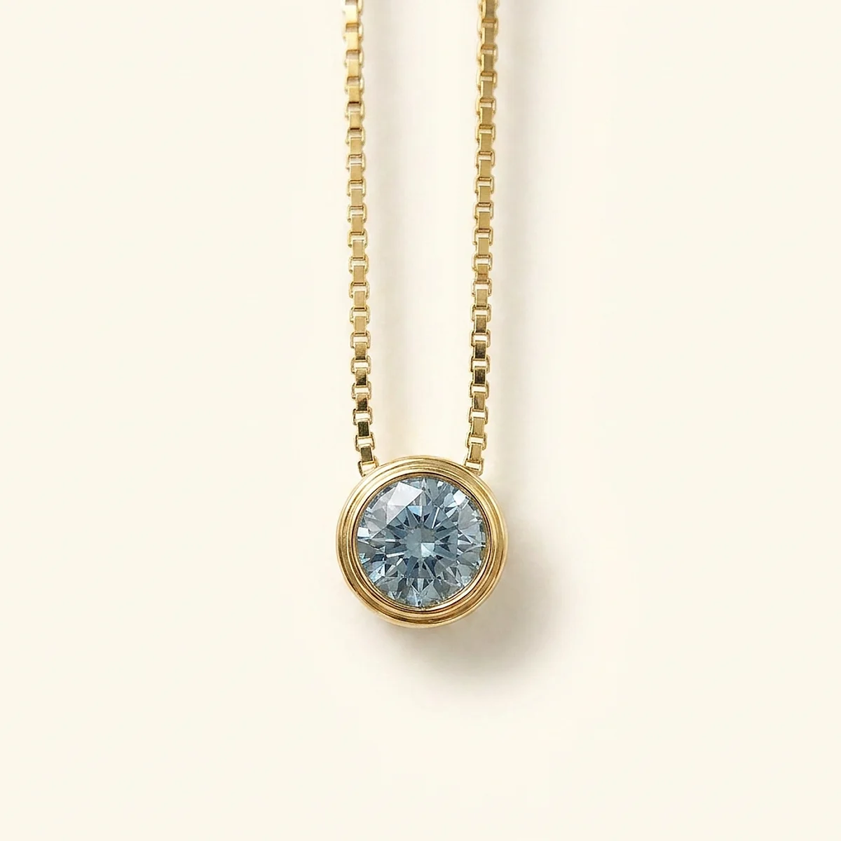 A .5ct blue round diamond on a yellow gold necklace, custom-designed by Eterneva to honor the remarkable Dan.