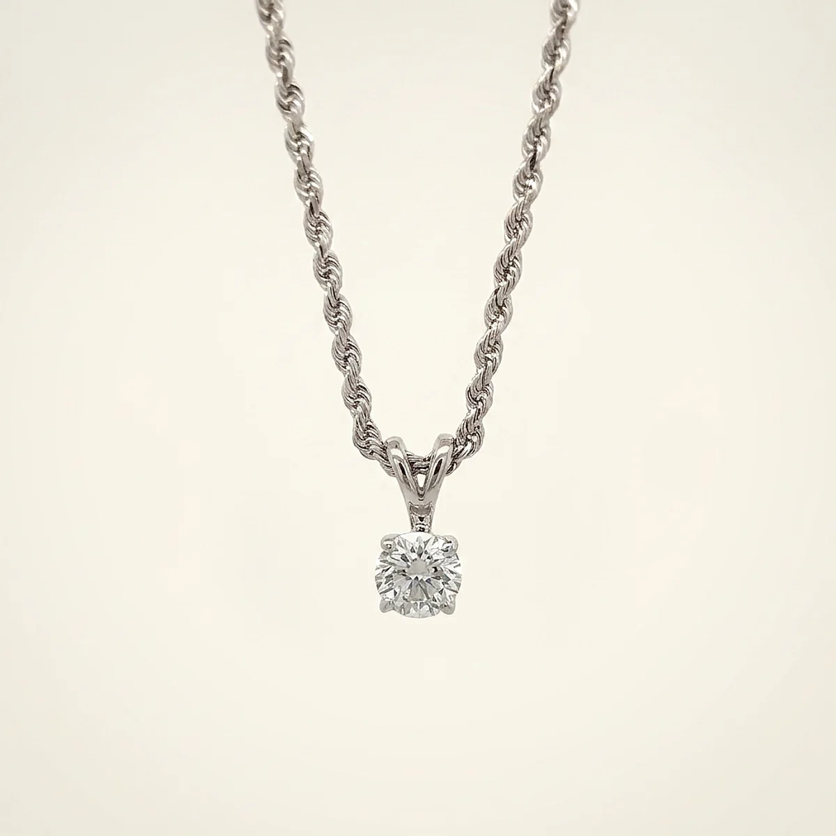 A .5ct colorless round diamond on a white gold necklace, custom-designed by Eterneva to honor the remarkable Senthil.