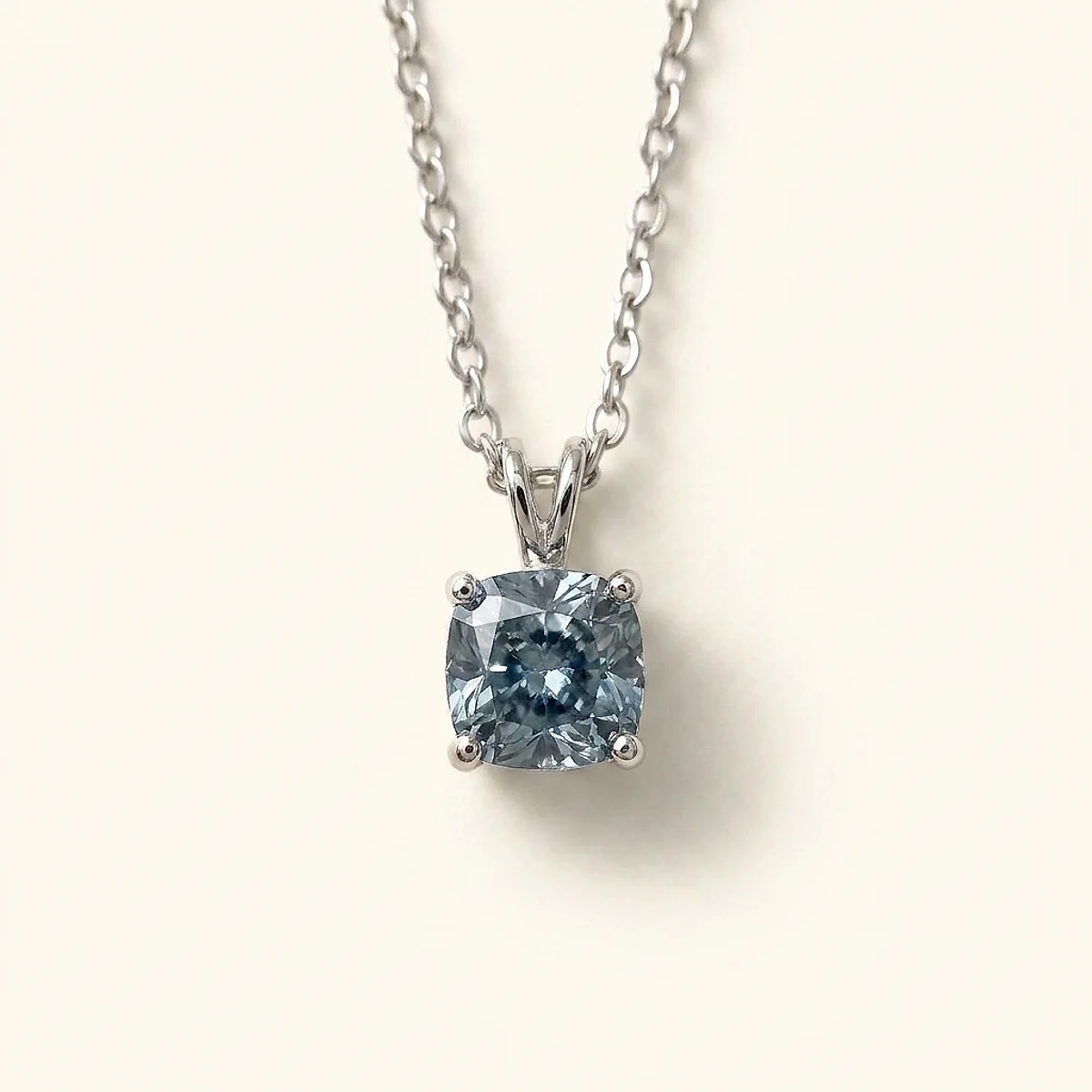 A 1ct blue cushion diamond on a white gold necklace, custom-designed by Eterneva to honor the remarkable Terry.