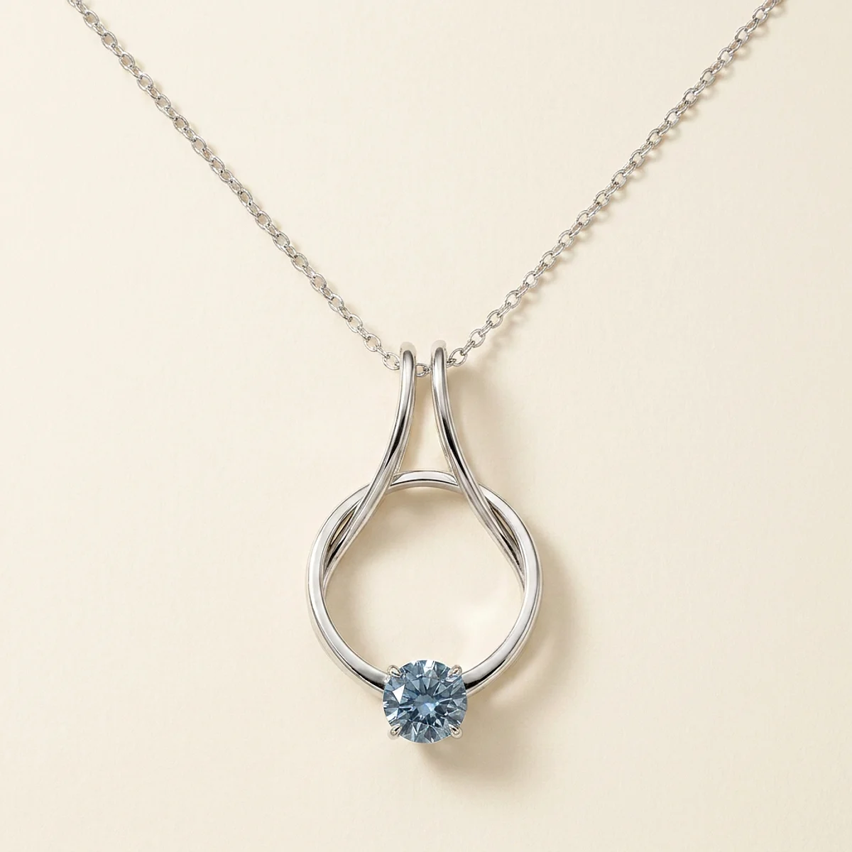 A 1ct blue round diamond on a white gold necklace, custom-designed by Eterneva to honor the remarkable Kathy.
