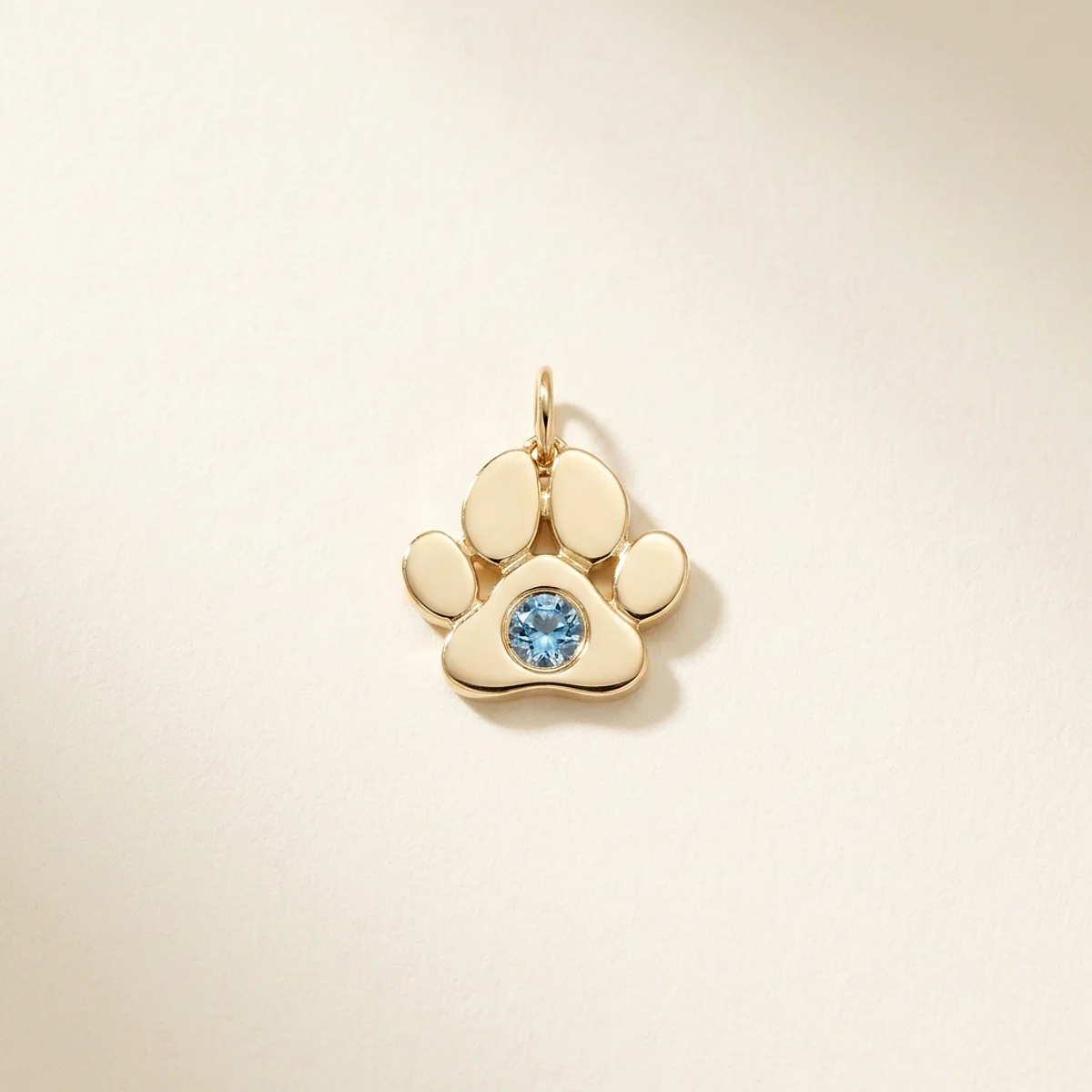 A .15ct blue round diamond on a yellow gold pendant, custom-designed by Eterneva to honor the remarkable Molly.
