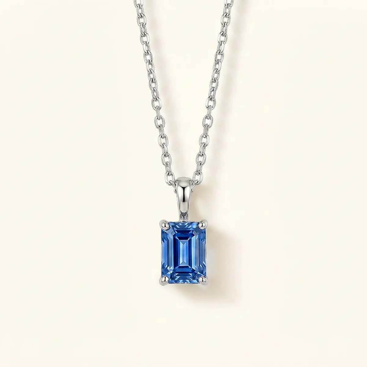 A .4ct blue rectangular radiant diamond on a white gold necklace, custom-designed by Eterneva to honor the remarkable Chewie.