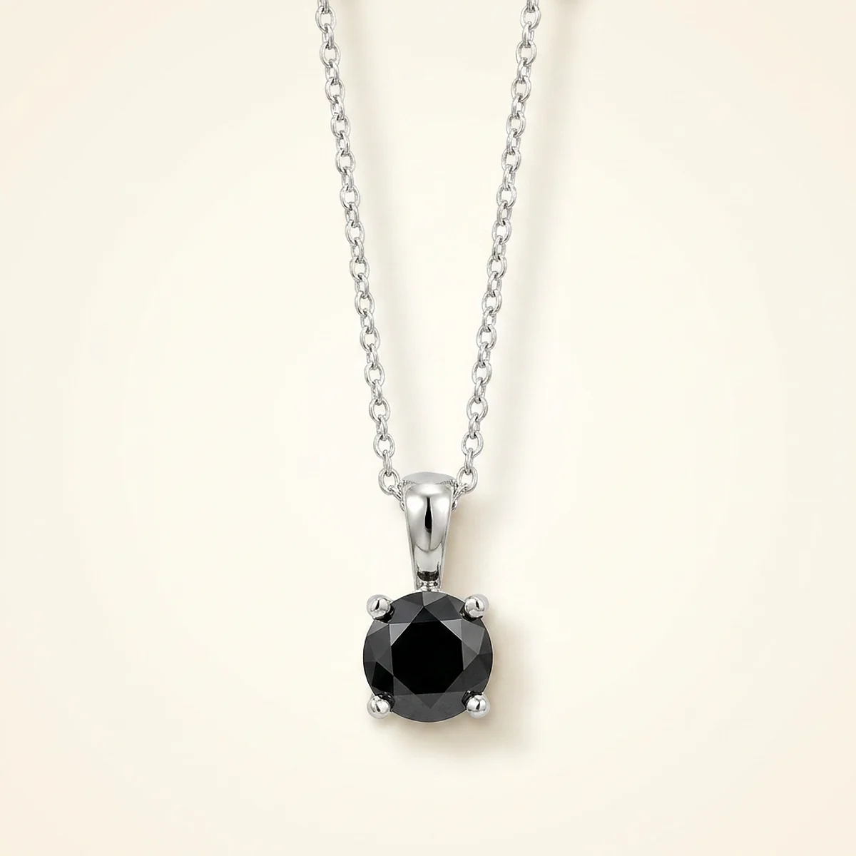 A .25ct black round diamond on a white gold necklace, custom-designed by Eterneva to honor the remarkable Branelly.