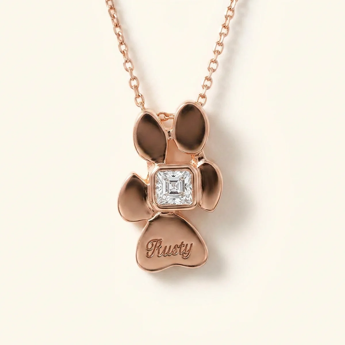 A .25ct colorless asscher diamond on a rose gold pendant, custom-designed by Eterneva to honor the remarkable Rusty.