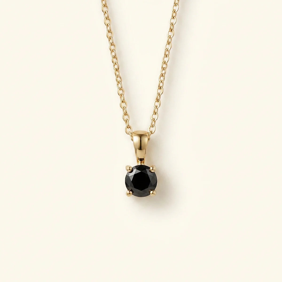 A .25ct black round diamond on a yellow gold pendant, custom-designed by Eterneva to honor the remarkable Veronica.