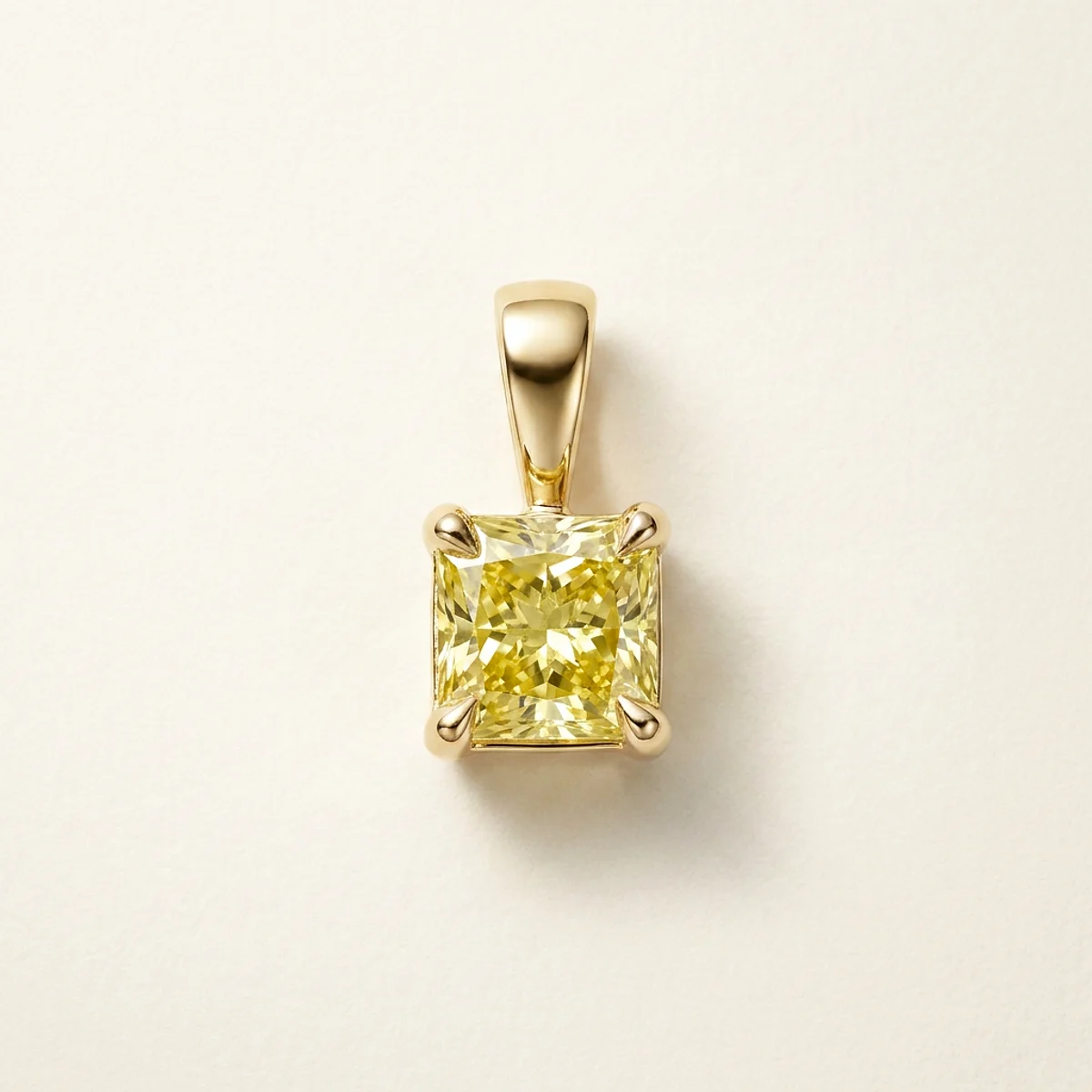 A .25ct yellow square radiant diamond on a yellow gold pendant, custom-designed by Eterneva to honor the remarkable Betty.