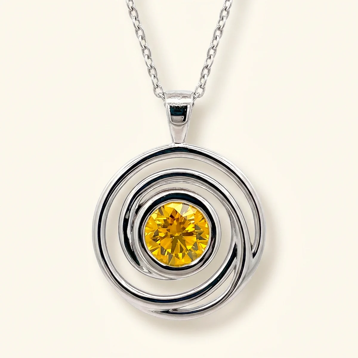 A .5ct yellow round diamond on a white gold pendant, custom-designed by Eterneva to honor the remarkable Lois.