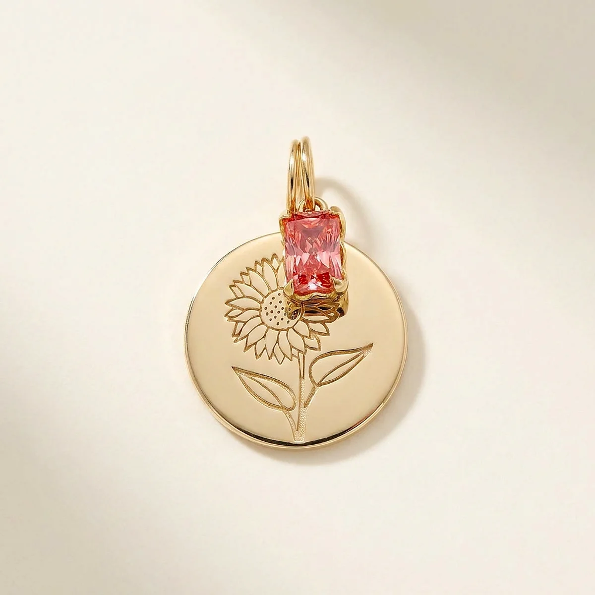 A .75ct pink rectangular radiant diamond on a yellow gold pendant, custom-designed by Eterneva to honor the remarkable Patty.
