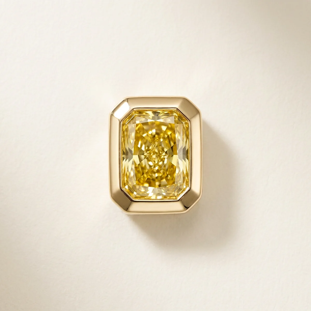 A 1ct yellow rectangular radiant diamond on a yellow gold pendant, custom-designed by Eterneva to honor the remarkable SweetPea.