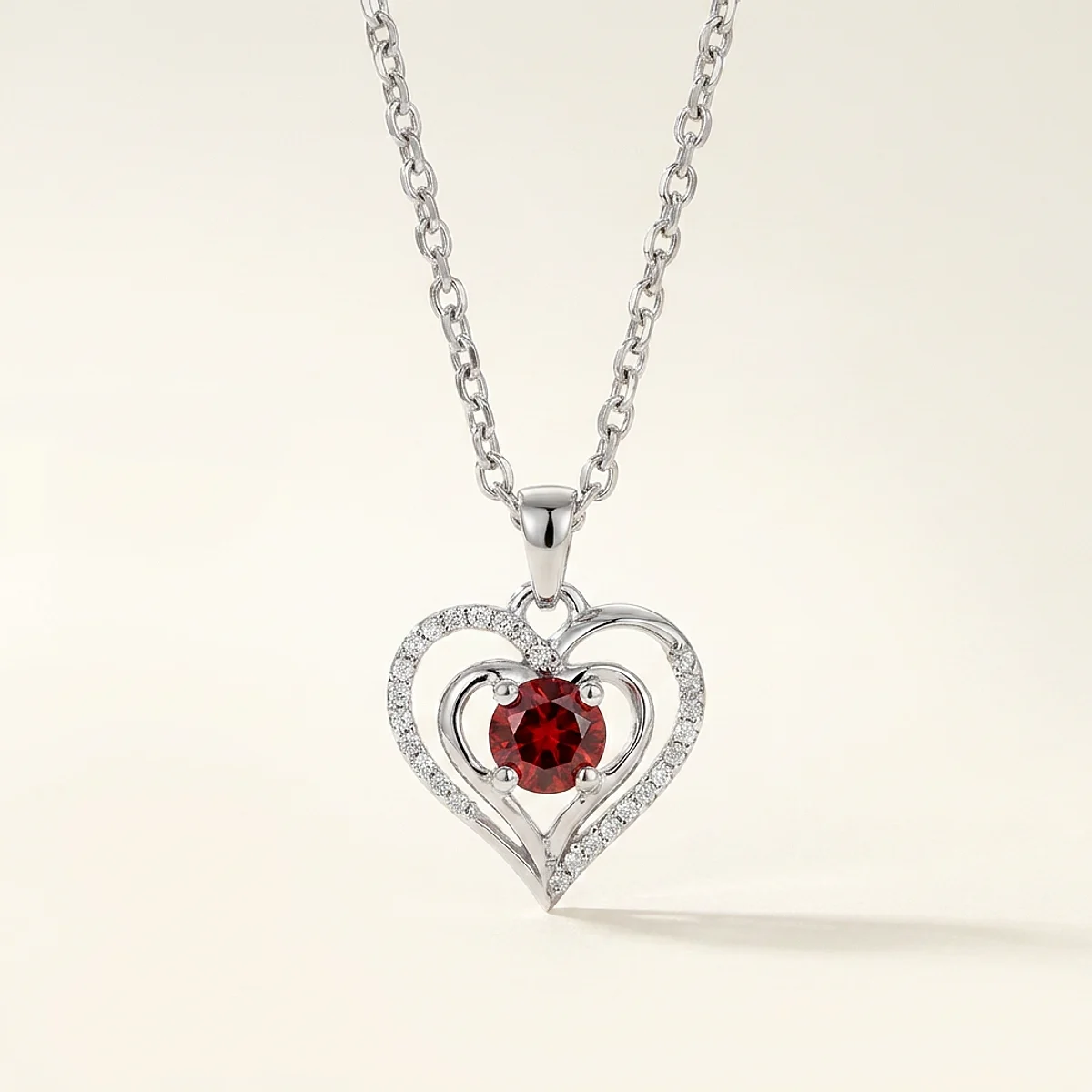 A .25ct red round diamond on a white gold pendant, custom-designed by Eterneva to honor the remarkable Jensen.