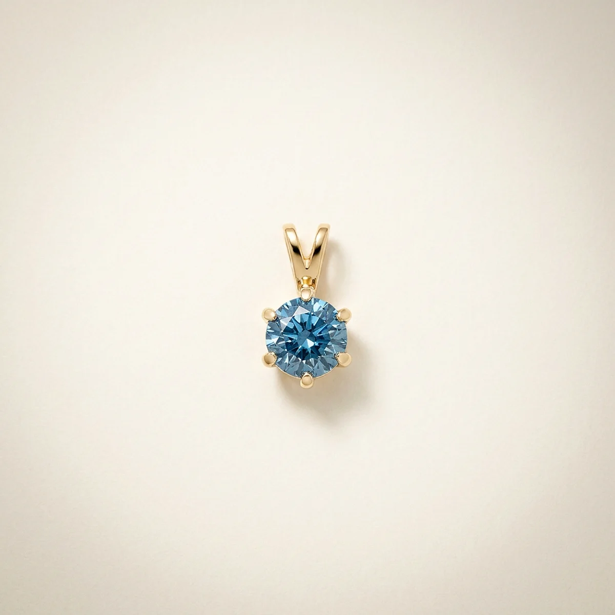 A .25ct blue round diamond on a yellow gold pendant, custom-designed by Eterneva to honor the remarkable Julio.