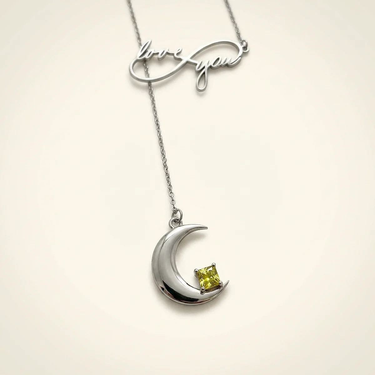 A .75ct green square radiant diamond on a white gold necklace, custom-designed by Eterneva to honor the remarkable Mama.