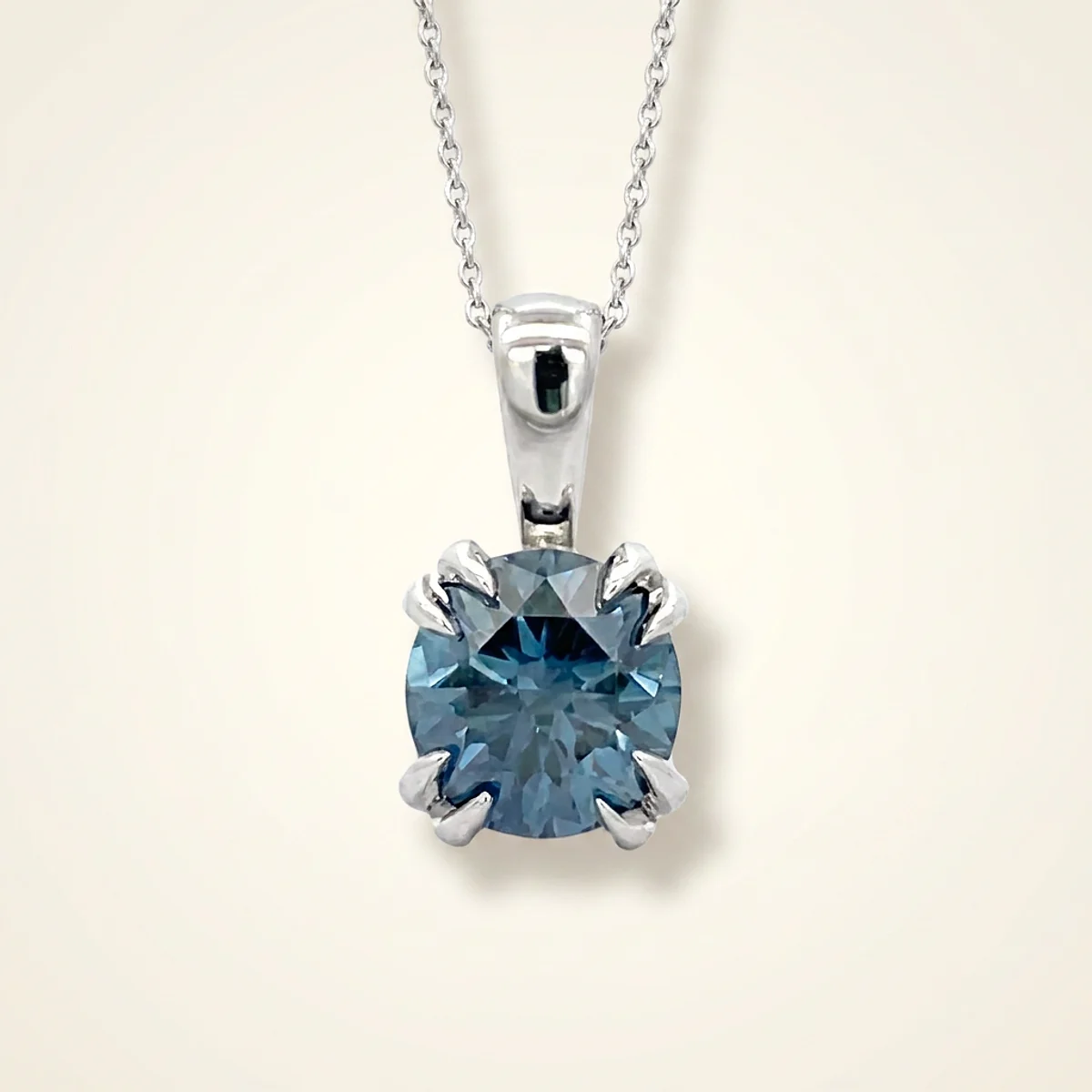A .4ct blue round diamond on a white gold pendant, custom-designed by Eterneva to honor the remarkable Rosalind.