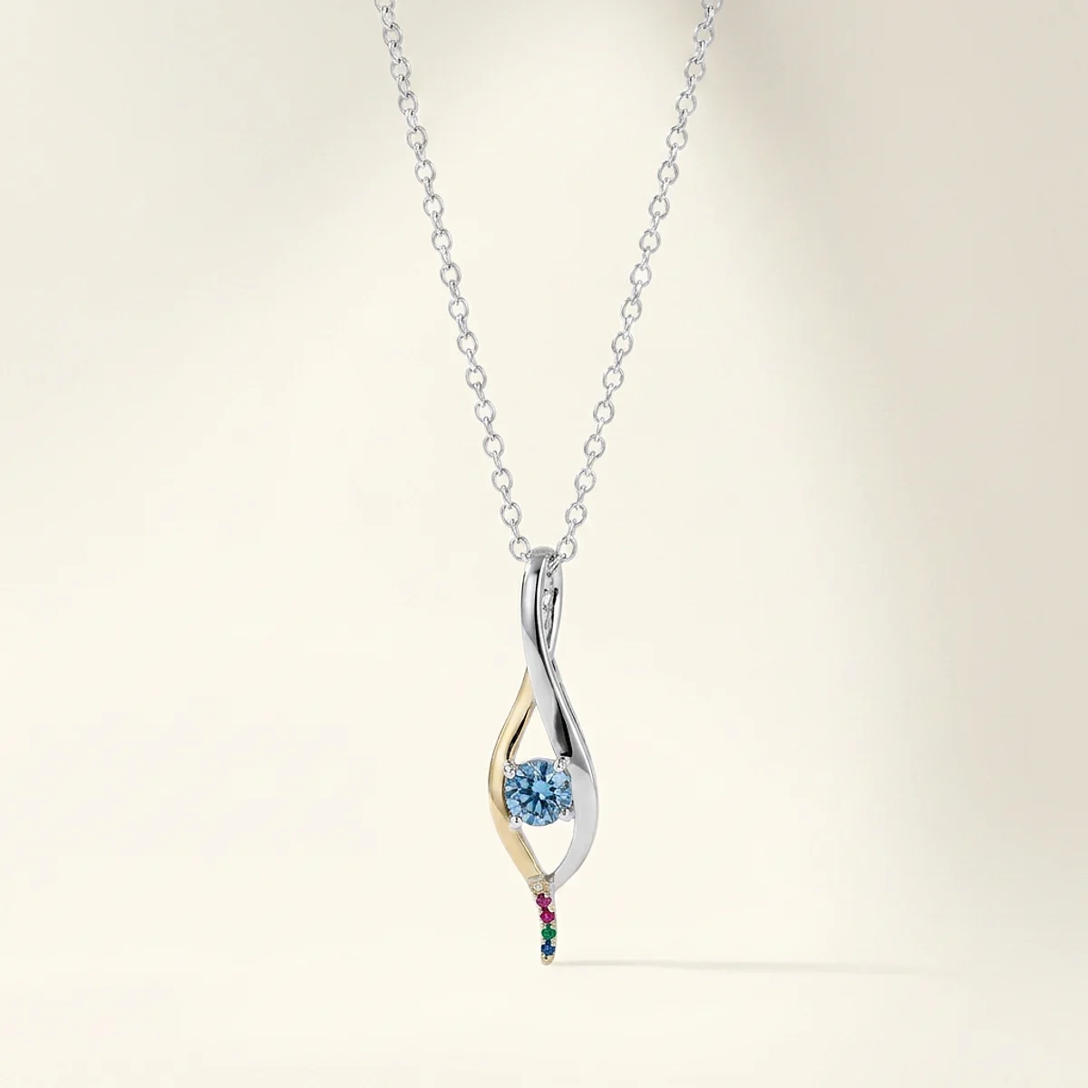 A .25ct blue round diamond on a mixed metal pendant, custom-designed by Eterneva to honor the remarkable Helena.