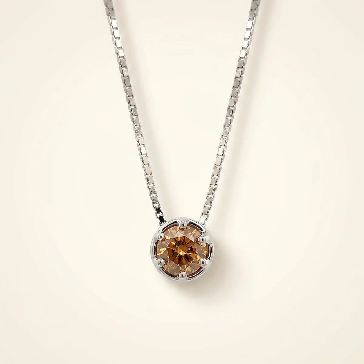A .75ct champagne round diamond on a white gold pendant, custom-designed by Eterneva to honor the remarkable Madison.