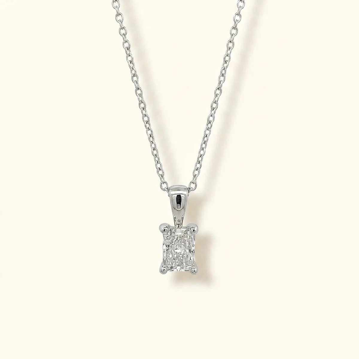 A .5ct colorless rectangular radiant diamond on a white gold pendant, custom-designed by Eterneva to honor the remarkable Neil.