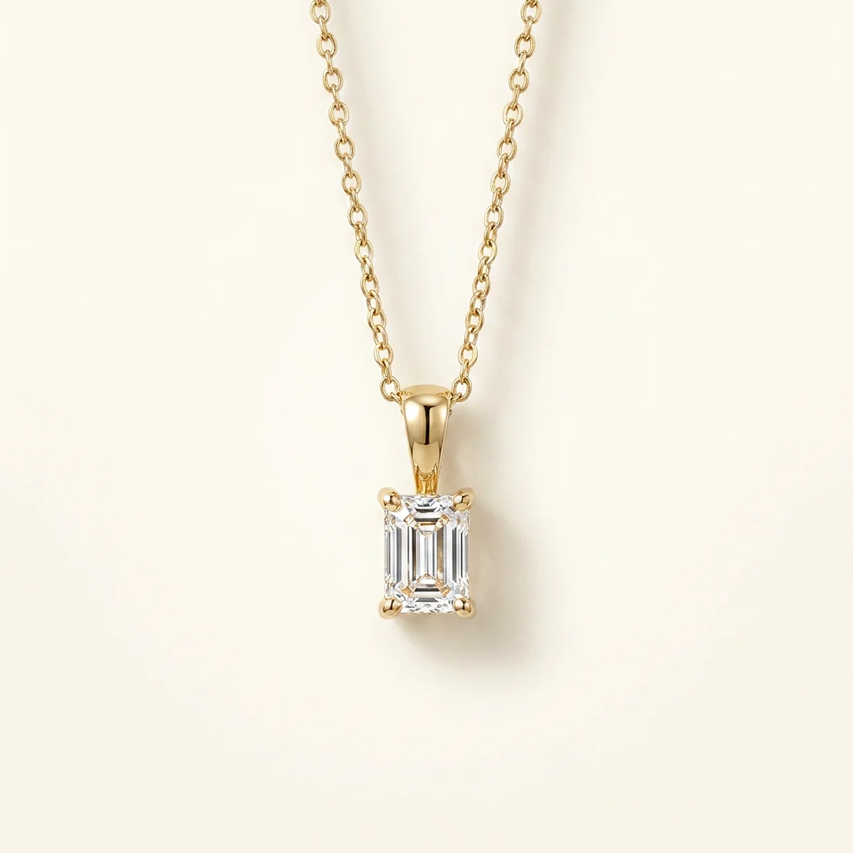A .5ct colorless rectangular radiant diamond on a yellow gold pendant, custom-designed by Eterneva to honor the remarkable Neil.