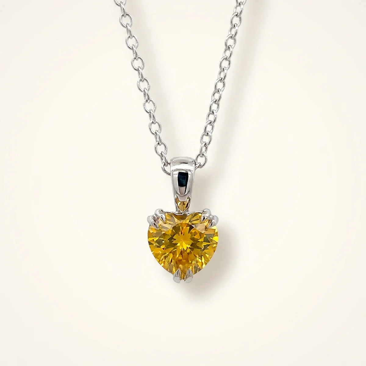 A .5ct yellow heart diamond on a white gold pendant, custom-designed by Eterneva to honor the remarkable J’Huti.