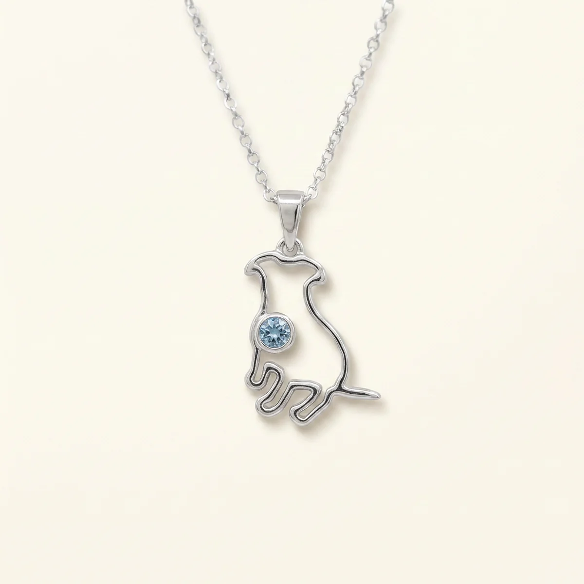 A .25ct blue round diamond on a white gold necklace, custom-designed by Eterneva to honor the remarkable Lucy-Lou.
