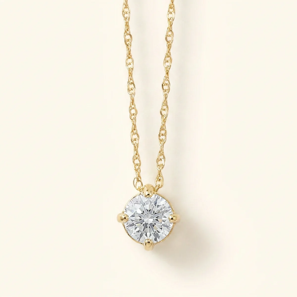 A .5ct blue round diamond on a yellow gold necklace, custom-designed by Eterneva to honor the remarkable Craig.