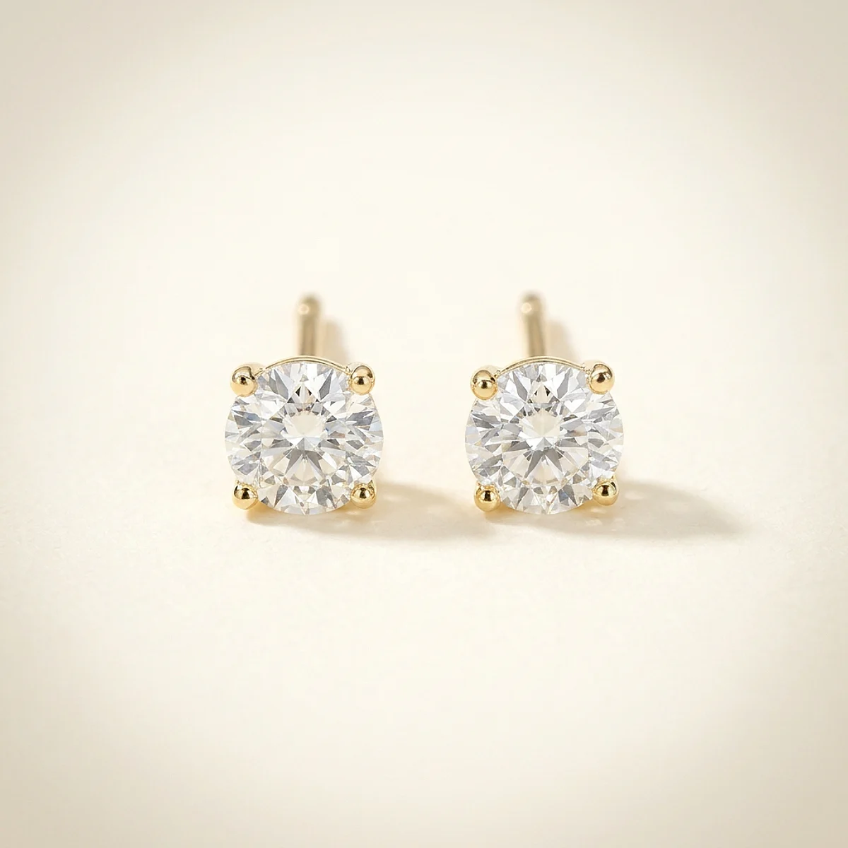 A .25ct colorless round diamond on yellow gold earrings, custom-designed by Eterneva to honor the remarkable Zia.