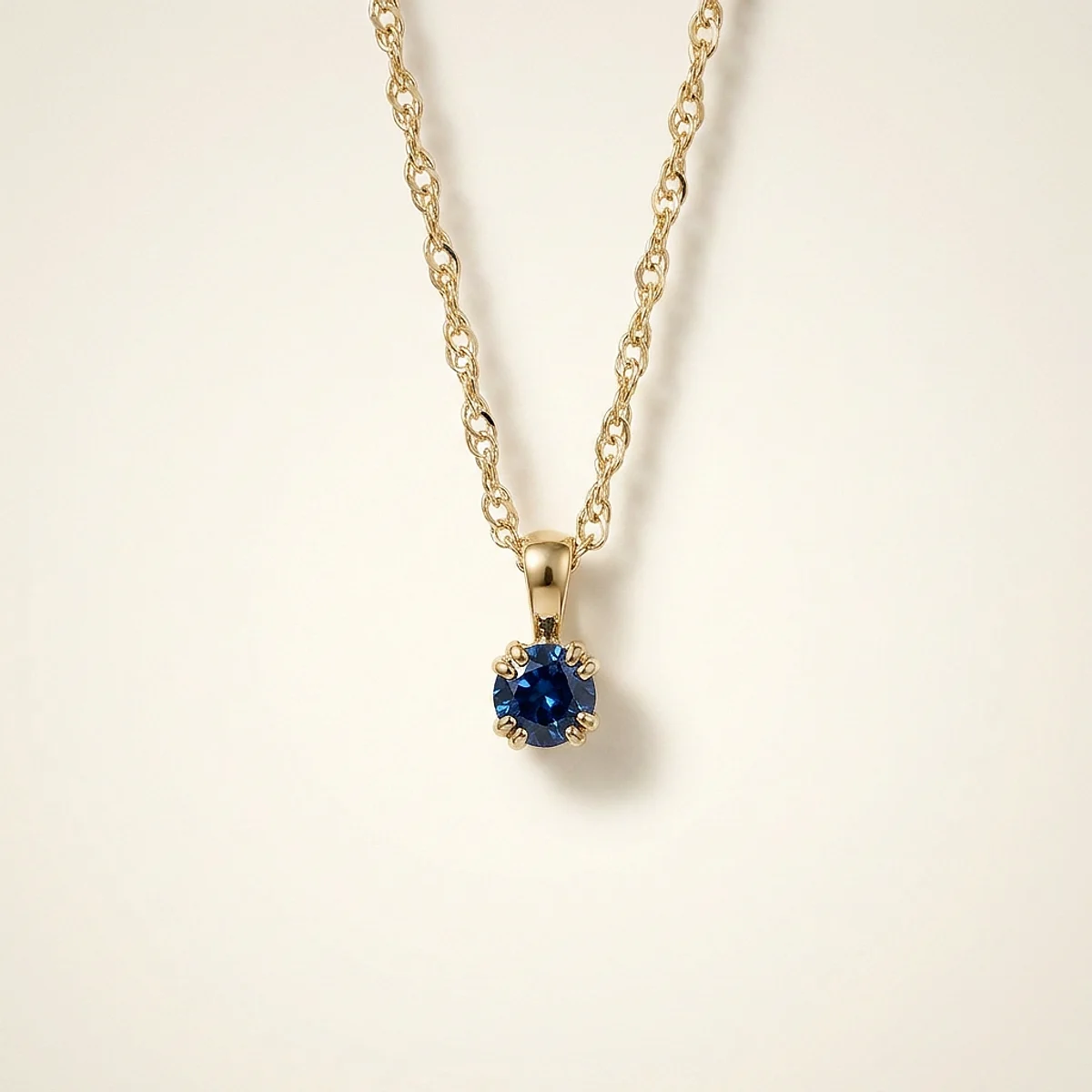 A .25ct blue round diamond on a yellow gold necklace, custom-designed by Eterneva to honor the remarkable Balthazar.
