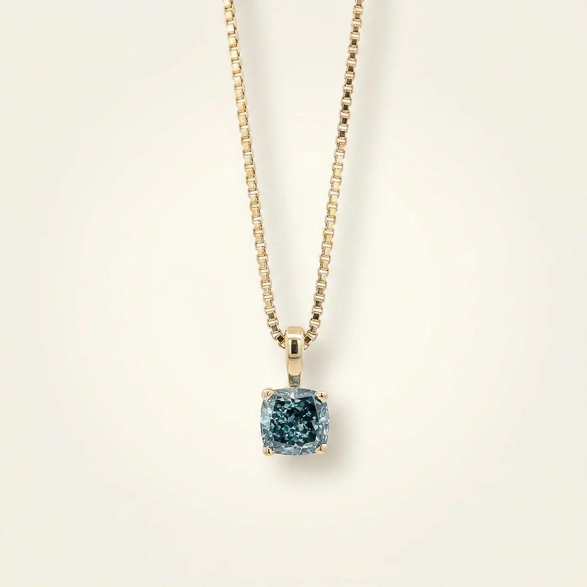 A .75ct blue cushion diamond on a yellow gold necklace, custom-designed by Eterneva to honor the remarkable Carol.