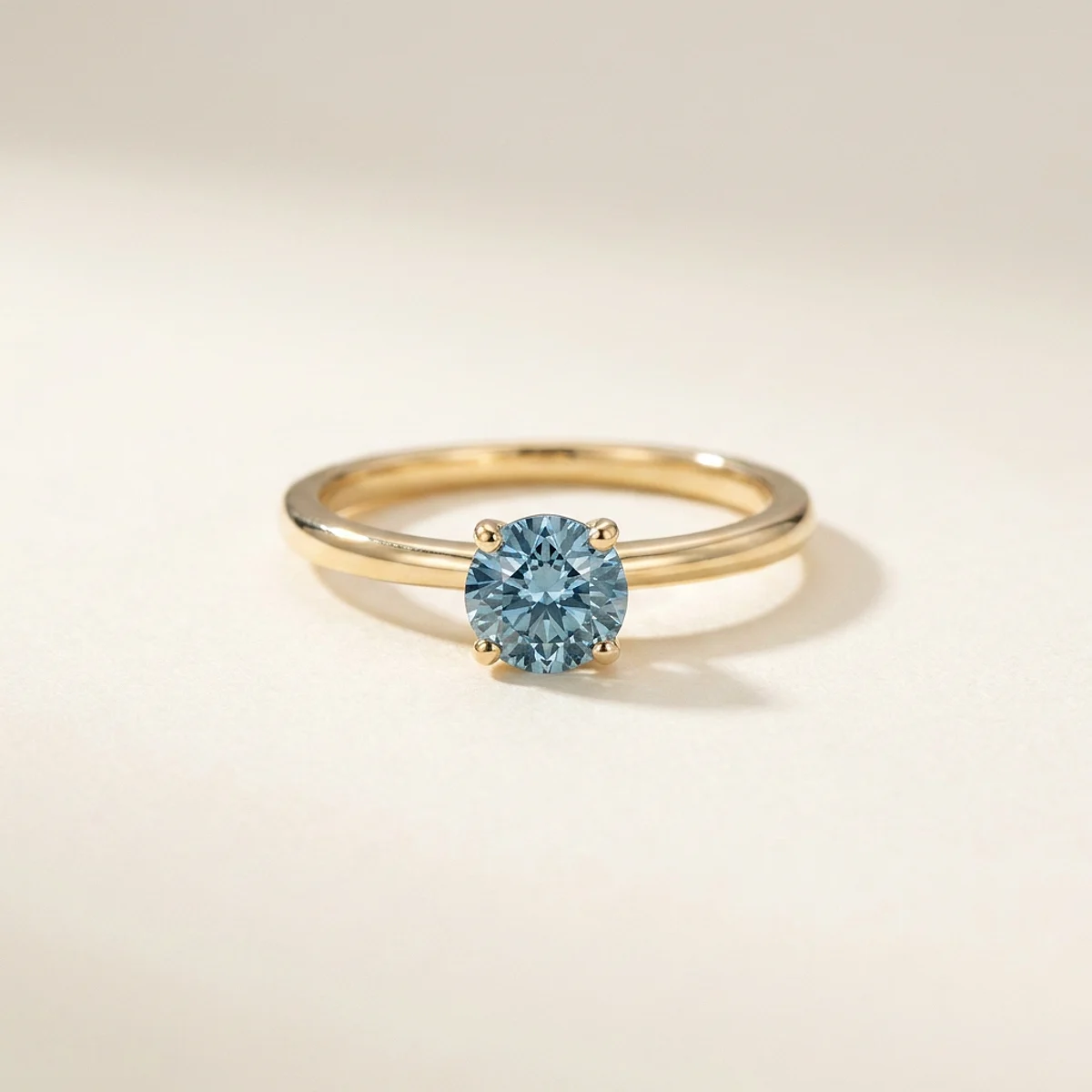 A .5ct blue round diamond on a yellow gold ring, custom-designed by Eterneva to honor the remarkable Frank.