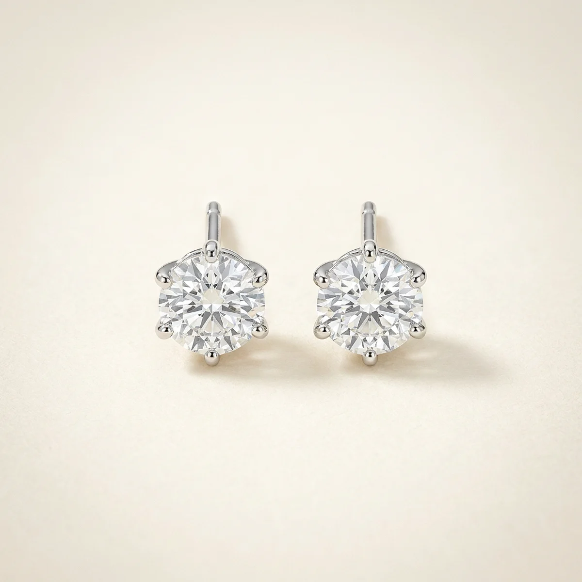 A .25ct colorless round diamond on white gold earrings, custom-designed by Eterneva to honor the remarkable Enya.