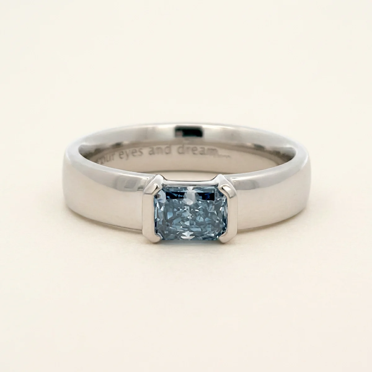 A .75ct blue rectangular radiant diamond on a platinum ring, custom-designed by Eterneva to honor the remarkable Lance.