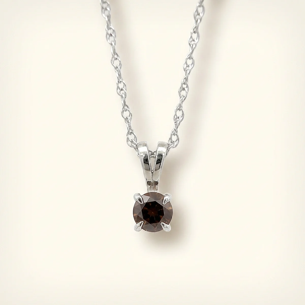 A .4ct red round diamond on a white gold necklace, custom-designed by Eterneva to honor the remarkable John.
