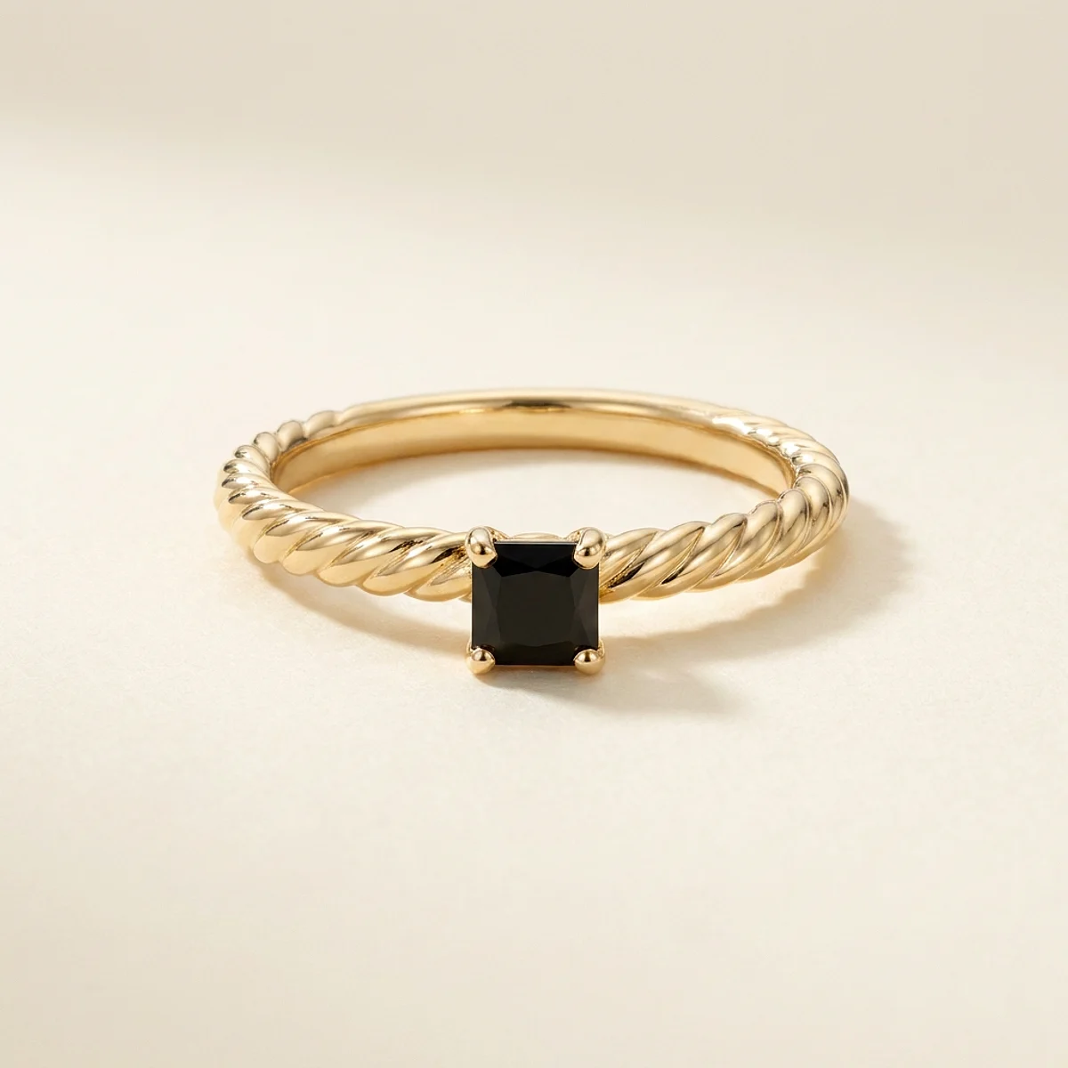 A .15ct black square radiant diamond on a yellow gold ring, custom-designed by Eterneva to honor the remarkable Phil.