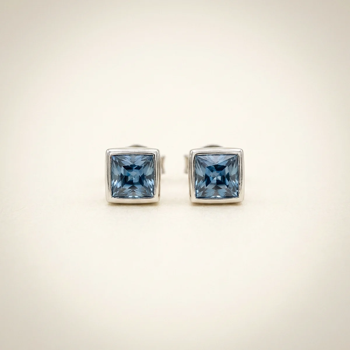A .15ct blue cushion diamond on white gold earrings, custom-designed by Eterneva to honor the remarkable Mary.