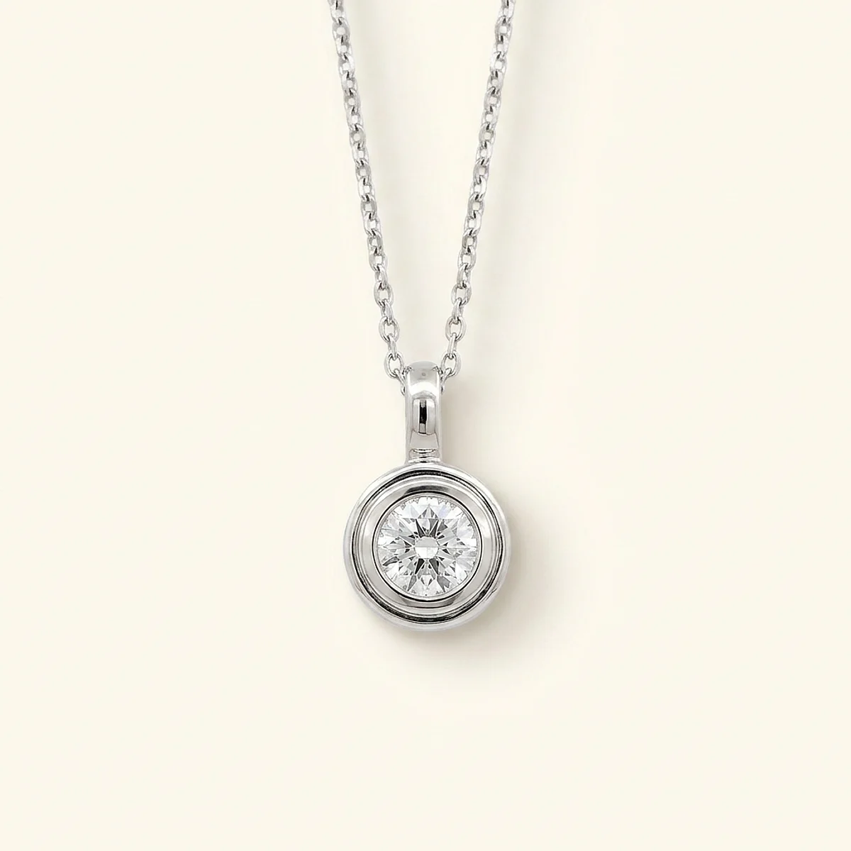 A .4ct colorless round diamond on a white gold pendant, custom-designed by Eterneva to honor the remarkable Sun.