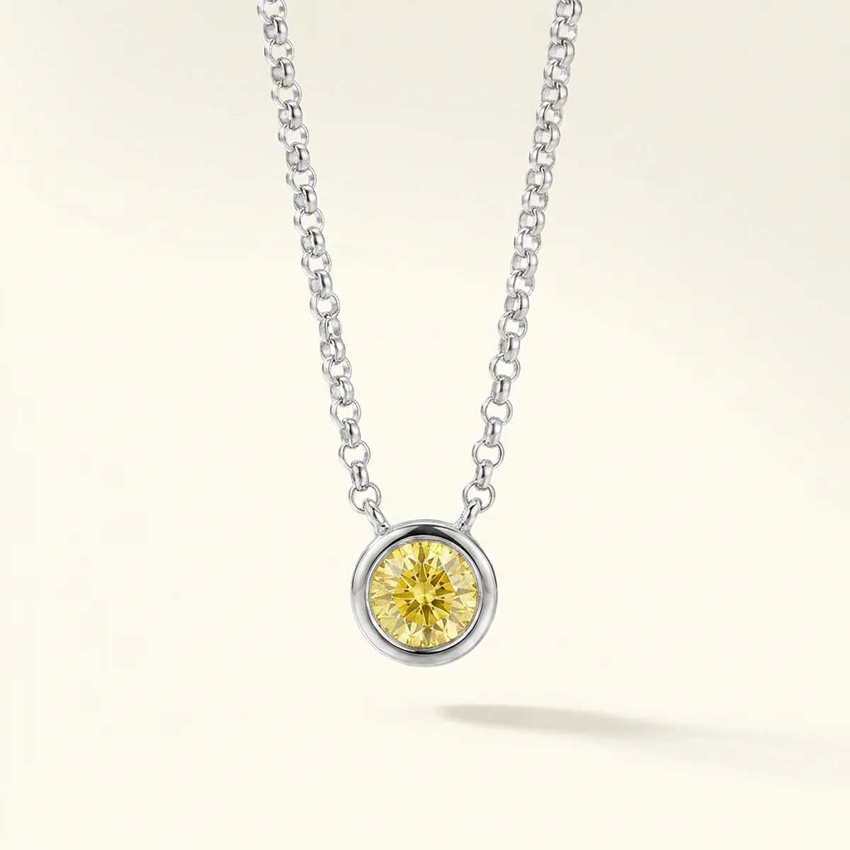 A .5ct yellow round diamond on a white gold necklace, custom-designed by Eterneva to honor the remarkable Hattie.