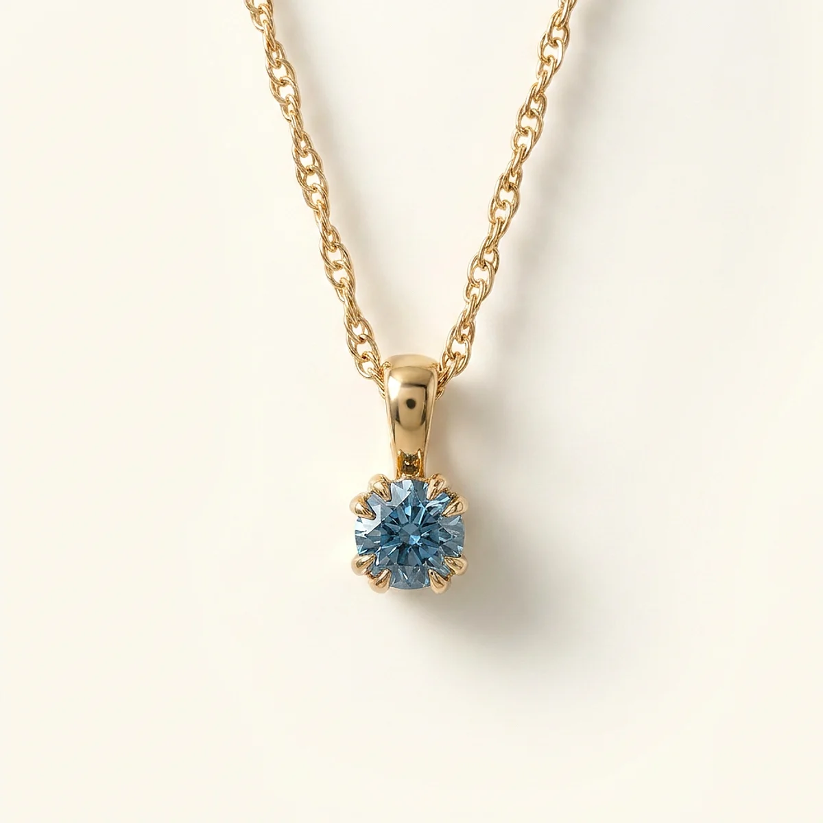 A .25ct blue round diamond on a yellow gold pendant, custom-designed by Eterneva to honor the remarkable Christian.