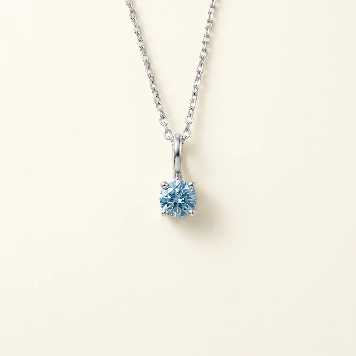 A .15ct blue round diamond on a white gold pendant, custom-designed by Eterneva to honor the remarkable Jerry.