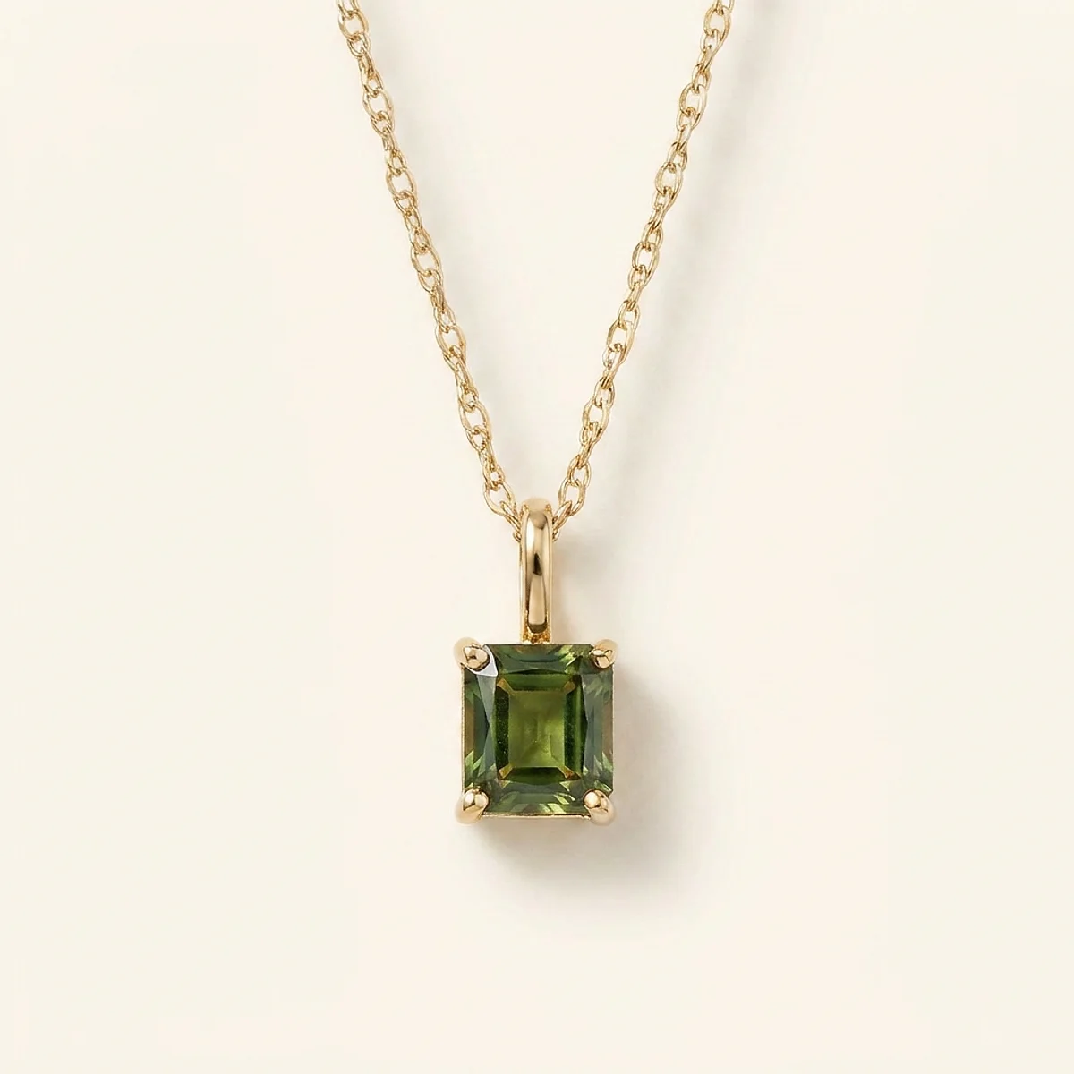 A .5ct green rectangular radiant diamond on a yellow gold pendant, custom-designed by Eterneva to honor the remarkable Richard.