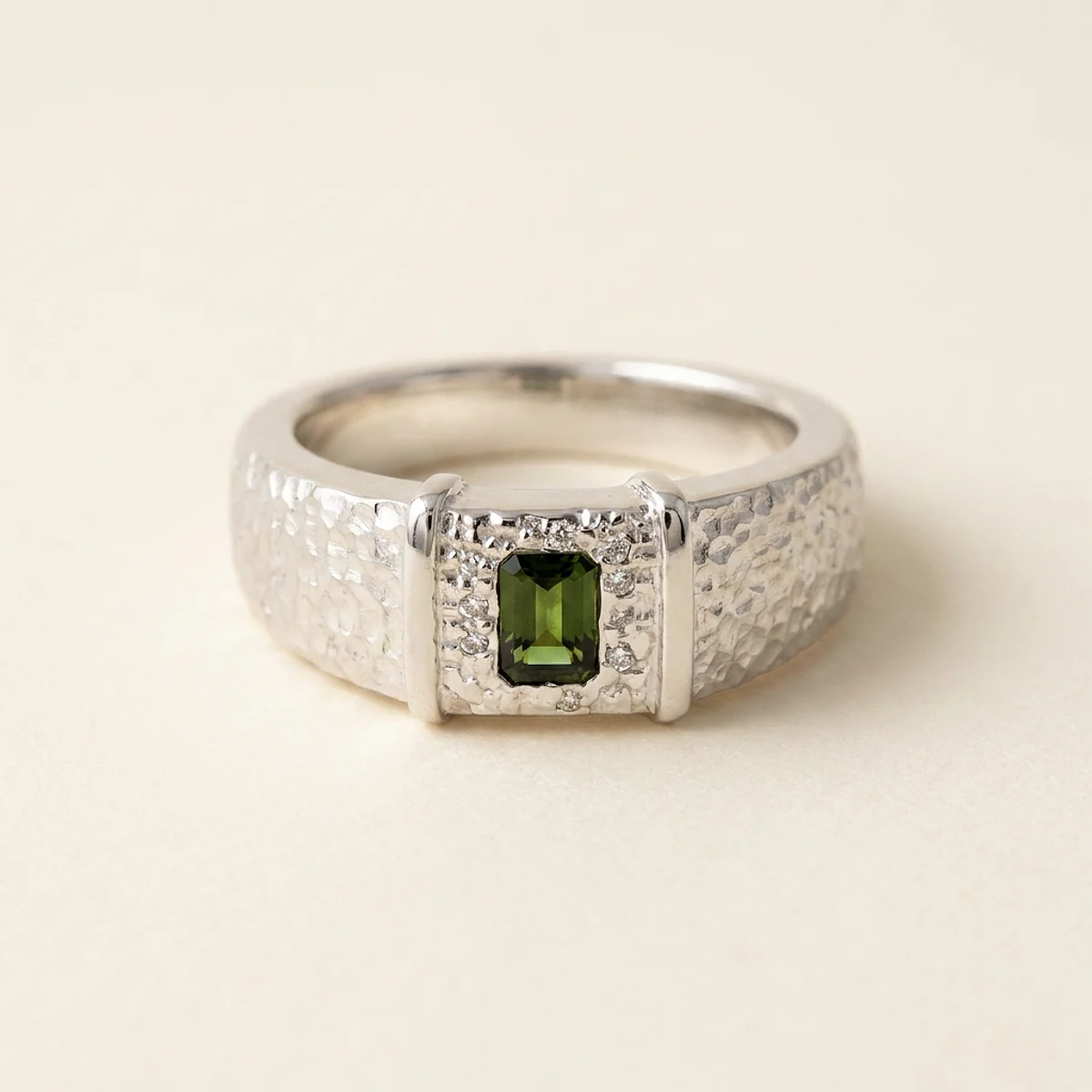A .4ct green emerald diamond on a white gold ring, custom-designed by Eterneva to honor the remarkable Cadbury.