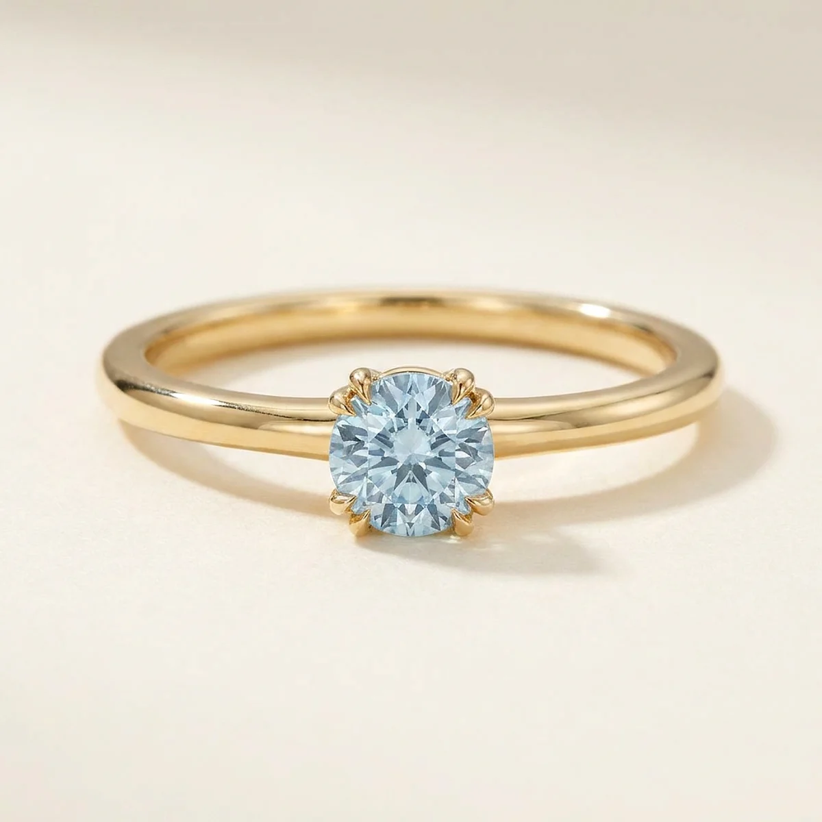 A .25ct blue round diamond on a yellow gold ring, custom-designed by Eterneva to honor the remarkable Joseph.