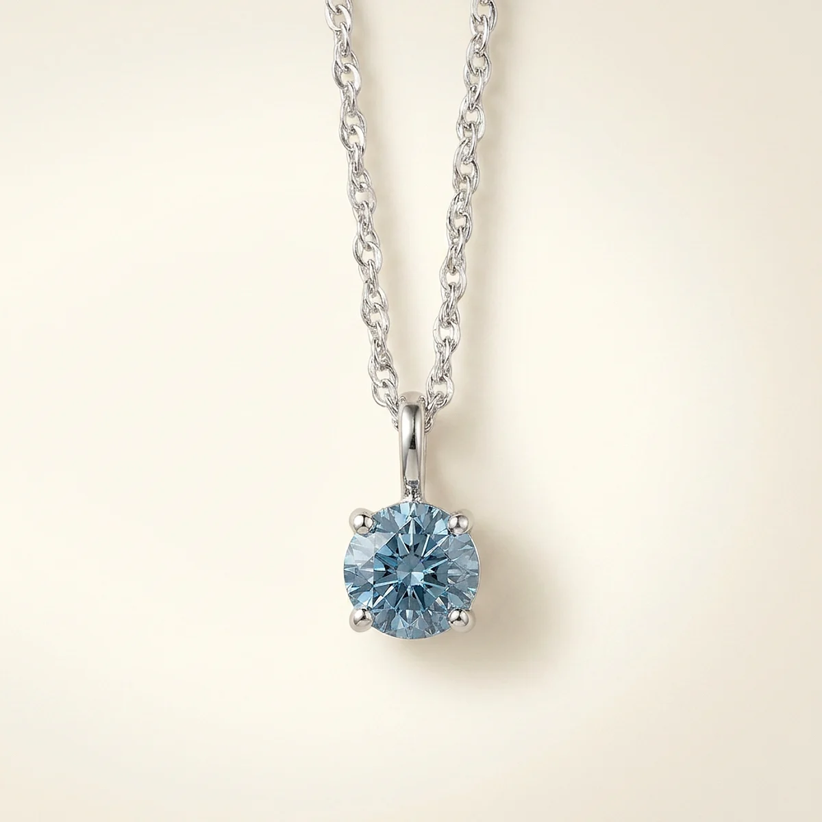 A .4ct blue round diamond on a white gold necklace, custom-designed by Eterneva to honor the remarkable Prince.