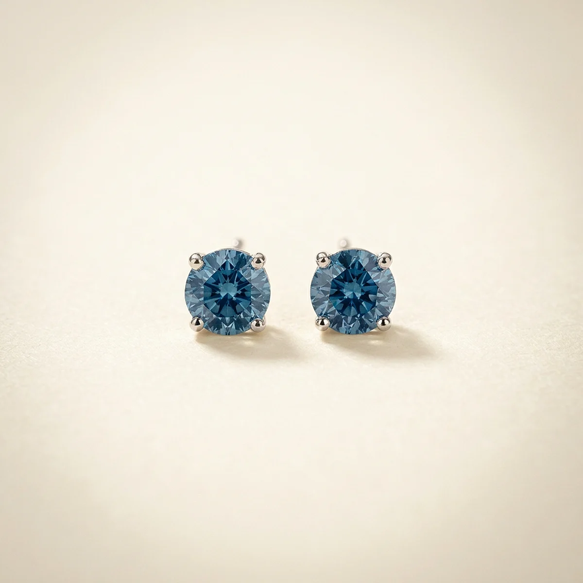 A .5ct blue round diamond on white gold earrings, custom-designed by Eterneva to honor the remarkable Jerry.