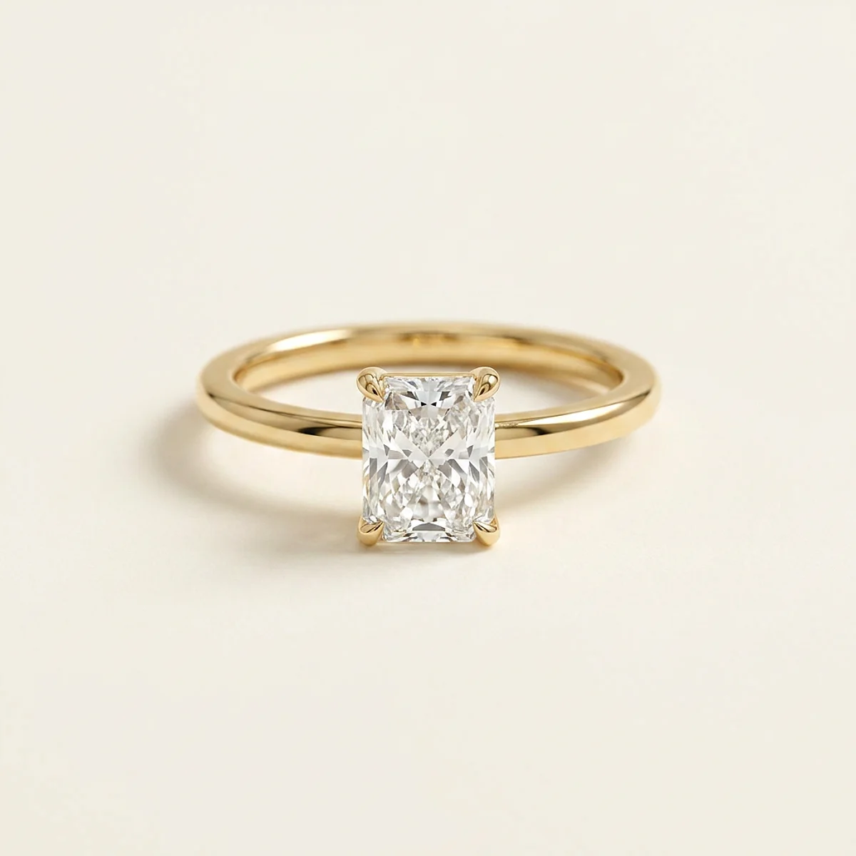 A 1ct colorless rectangular radiant diamond on a yellow gold ring, custom-designed by Eterneva to honor the remarkable Roxy.