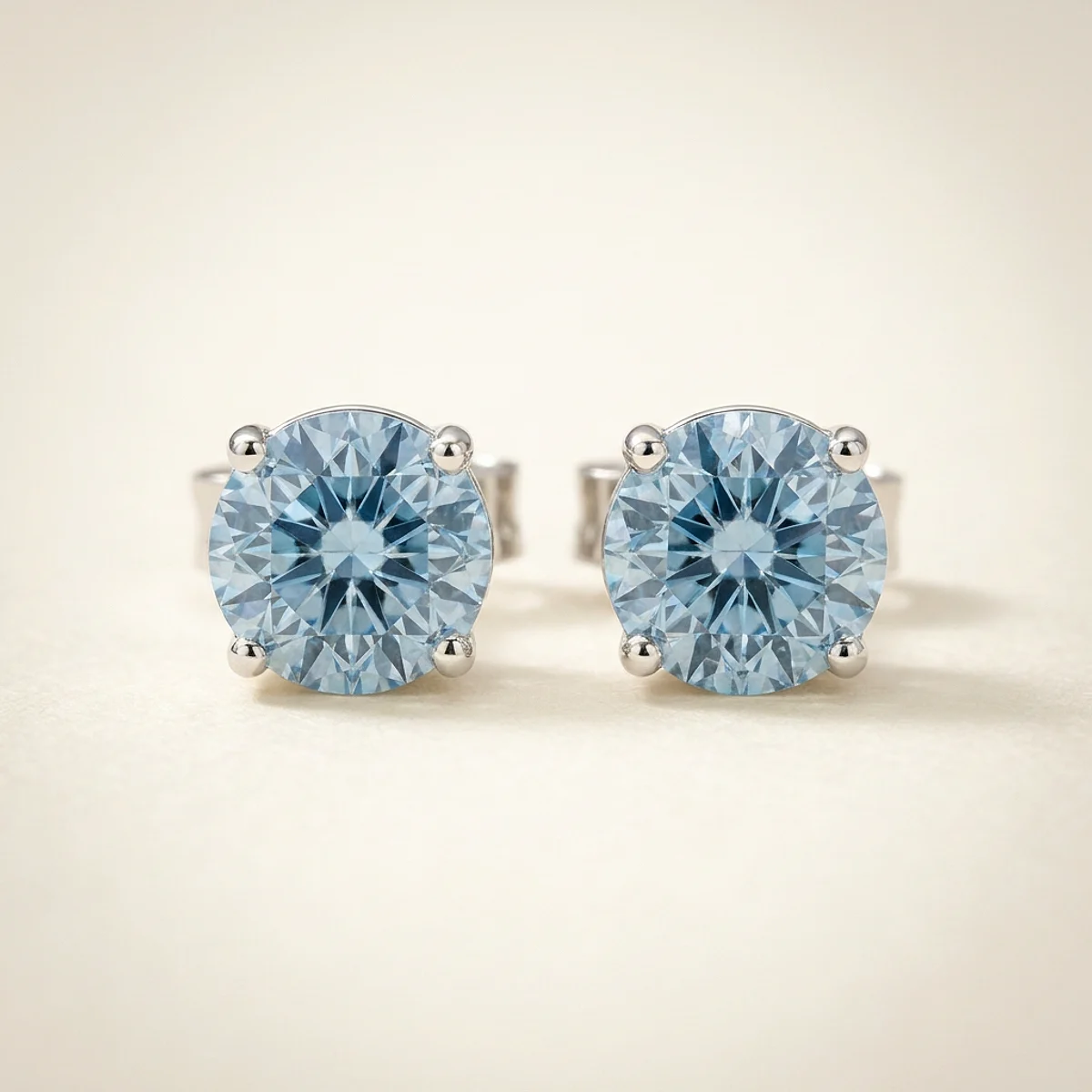 A .5ct blue round diamond on white gold earrings, custom-designed by Eterneva to honor the remarkable Lola.