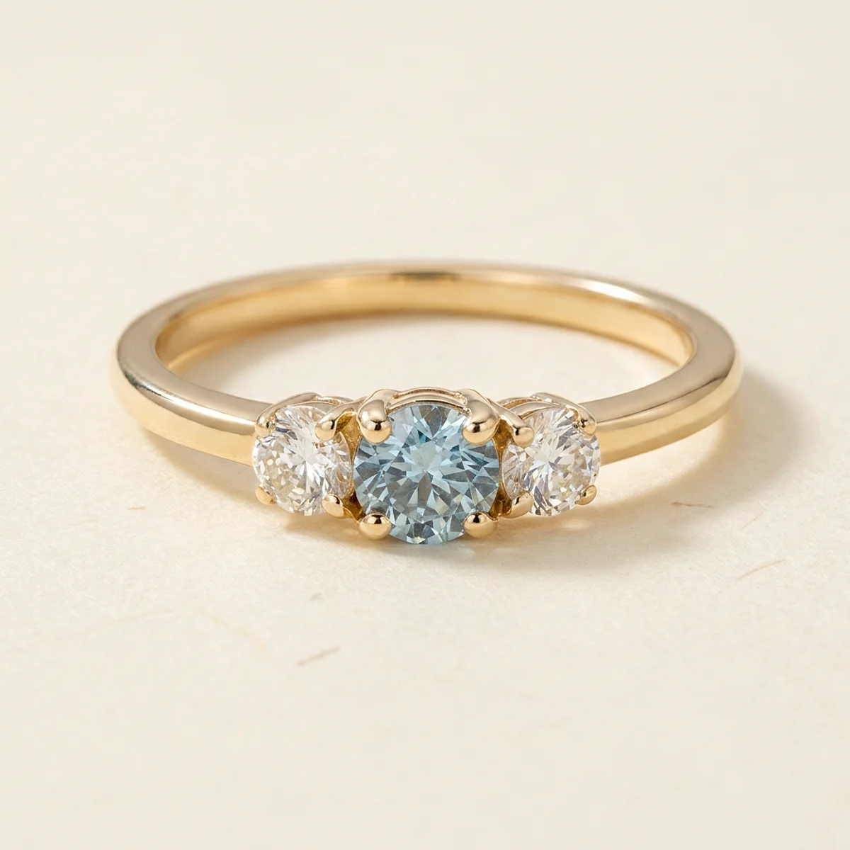 A .4ct blue round diamond on a yellow gold ring, custom-designed by Eterneva to honor the remarkable Jaxon.